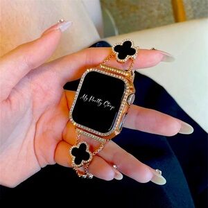 Beautiful rose gold strap with black clover outline with little diamonds.